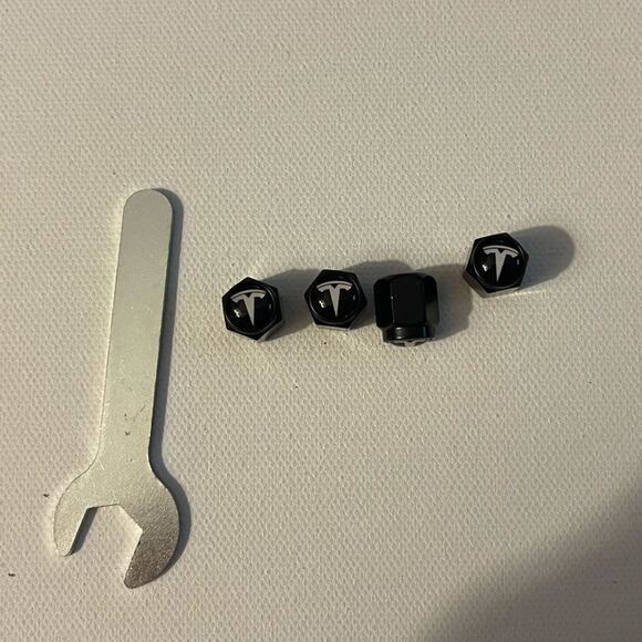 Tesla valve Stem caps in Black set of 4 NWT - Picture 1 of 4